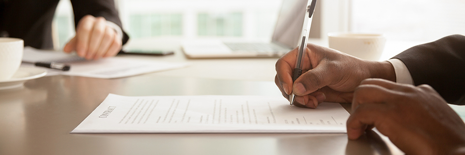Horizontal,Close,Up,Photo,African,Businessman,Sitting,At,Desk,Holds